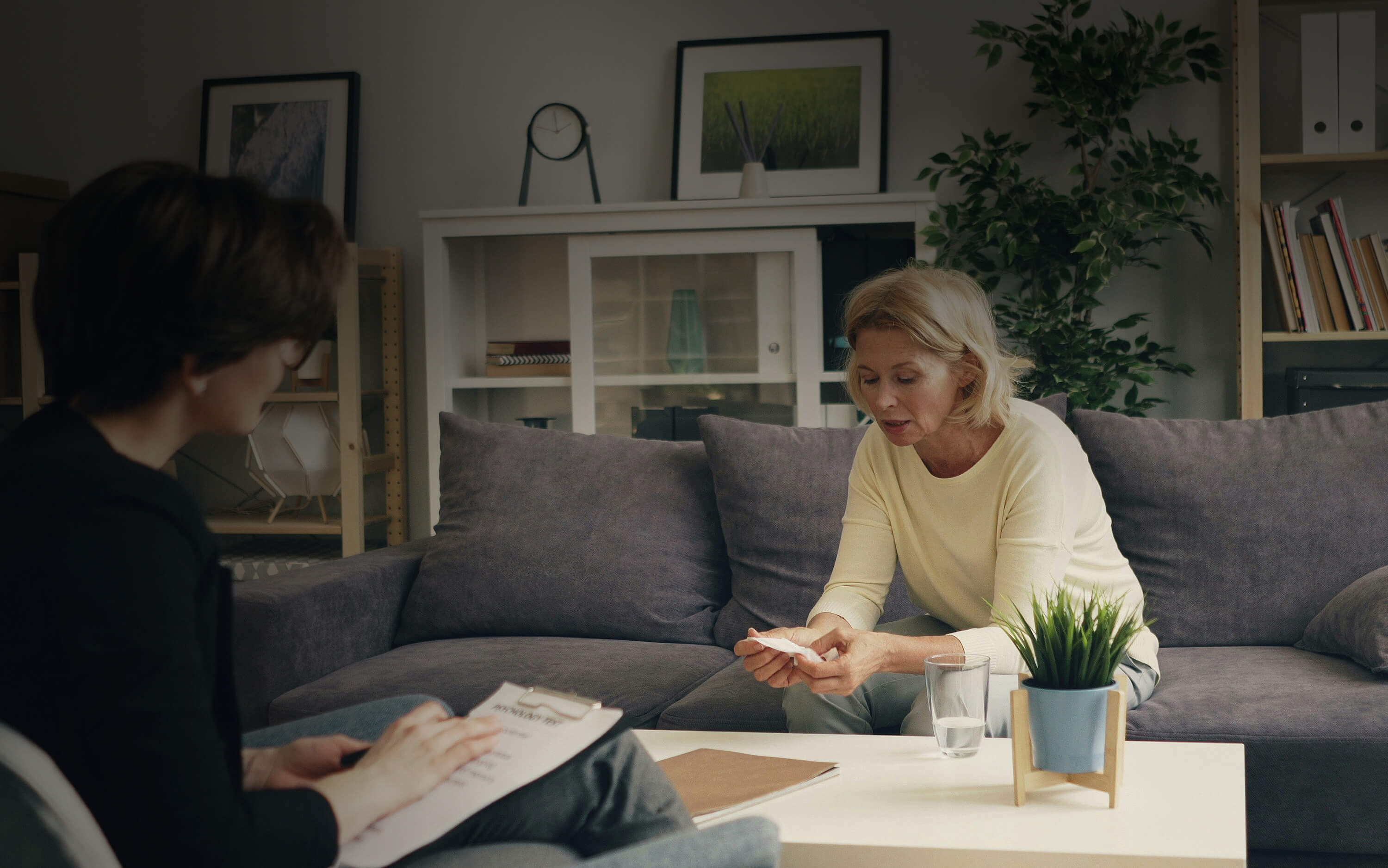 Woman sitting in room receiving counselling