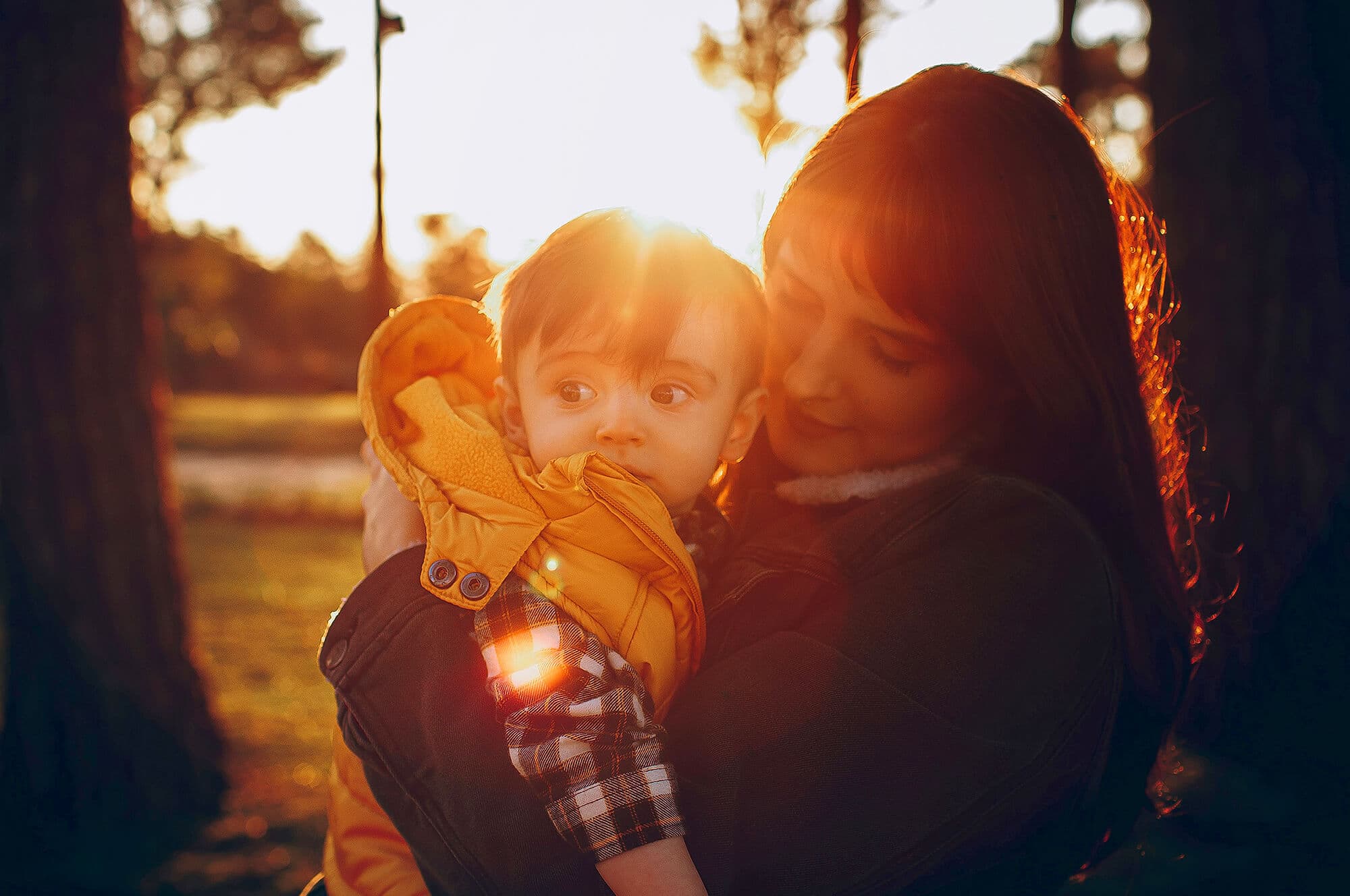 Young woman looking down at baby boy