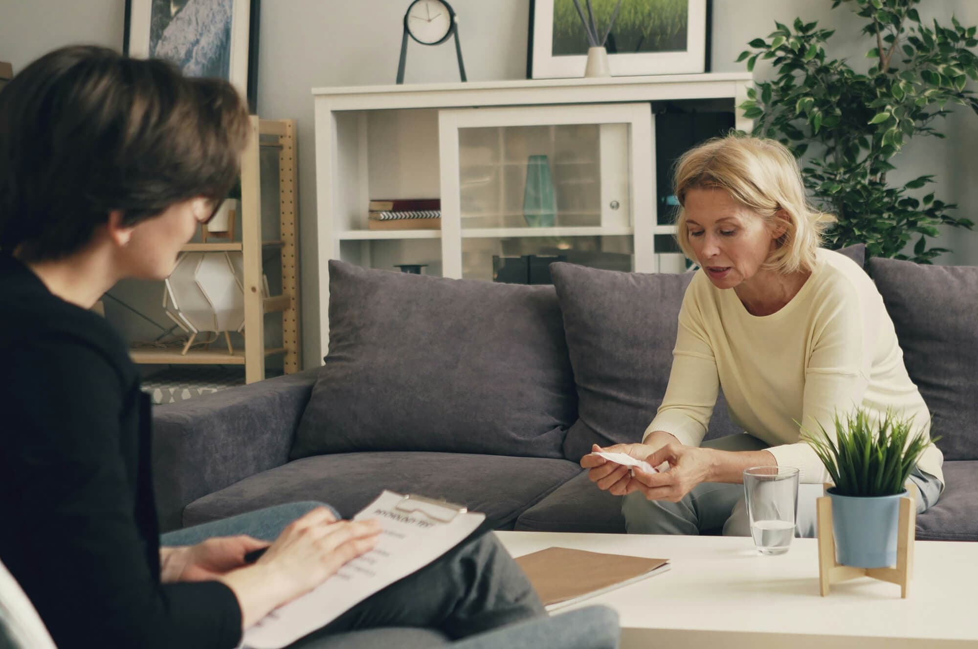 Woman sitting in room receiving counselling