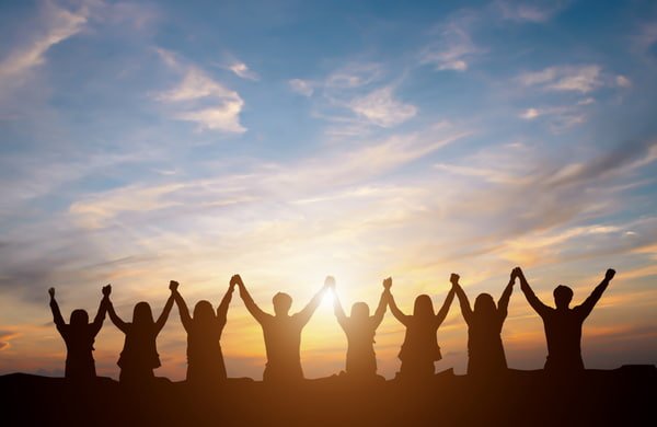 CAFS - Our team Group happy business team making high hands over head
