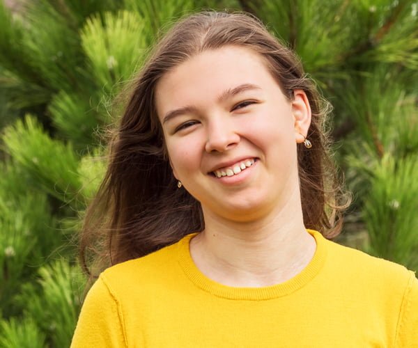 Cafs youth client Smiling teenage girl in a yellow sweater