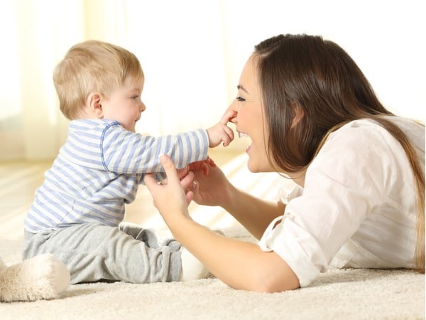 Cafs financial counselling client - Happy baby touching his mother face