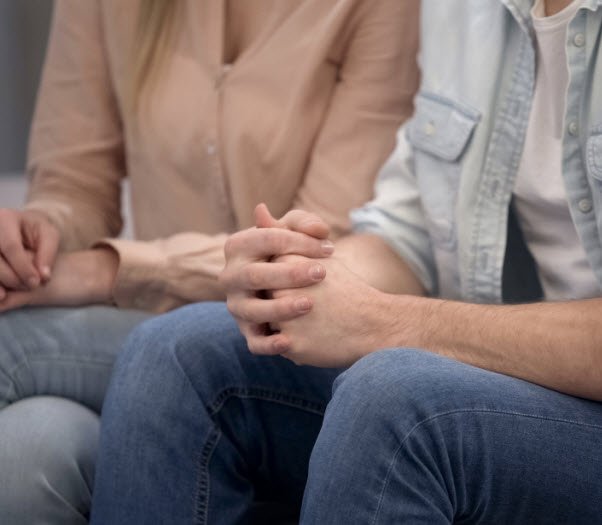 Two people sitting in family counselling
